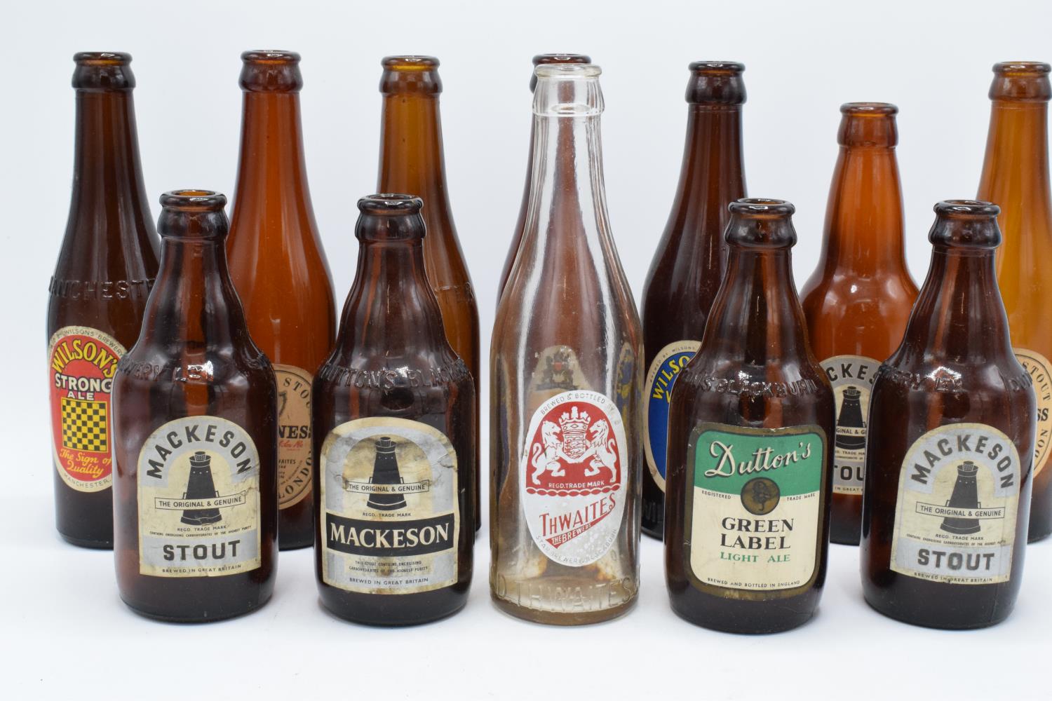 A collection of vintage 20th century beer bottles (mainly brown) to include makes such as Mackeson