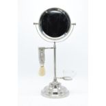 A chrome plated adjustable gentleman's shaving stand complete with an associated jug and brush.