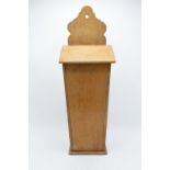 A Victorian light-coloured wooden candle box / salt box with working hinges. 53cm tall. Generally in