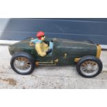 A vintage Reprocrafters style large model of a vintage car. 67cm long. In good condition generally