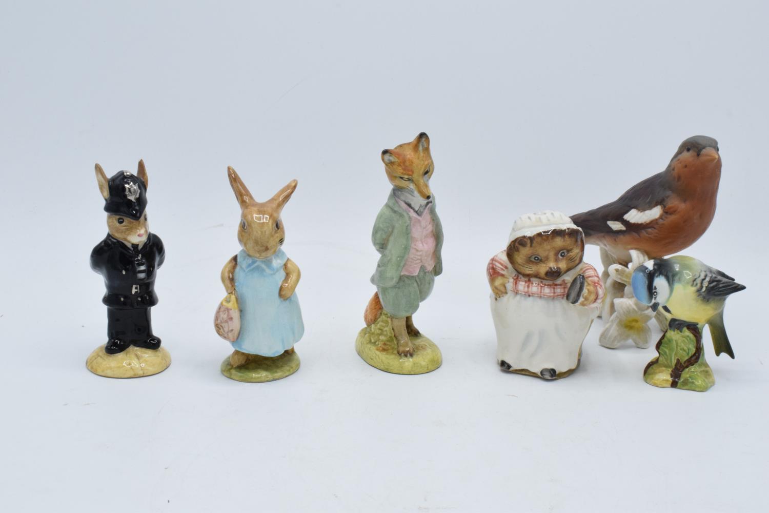 A mixed collection of pottery to include Beswick Beatrix Pottery figures Mrs Flopsy Bunny, Mrs