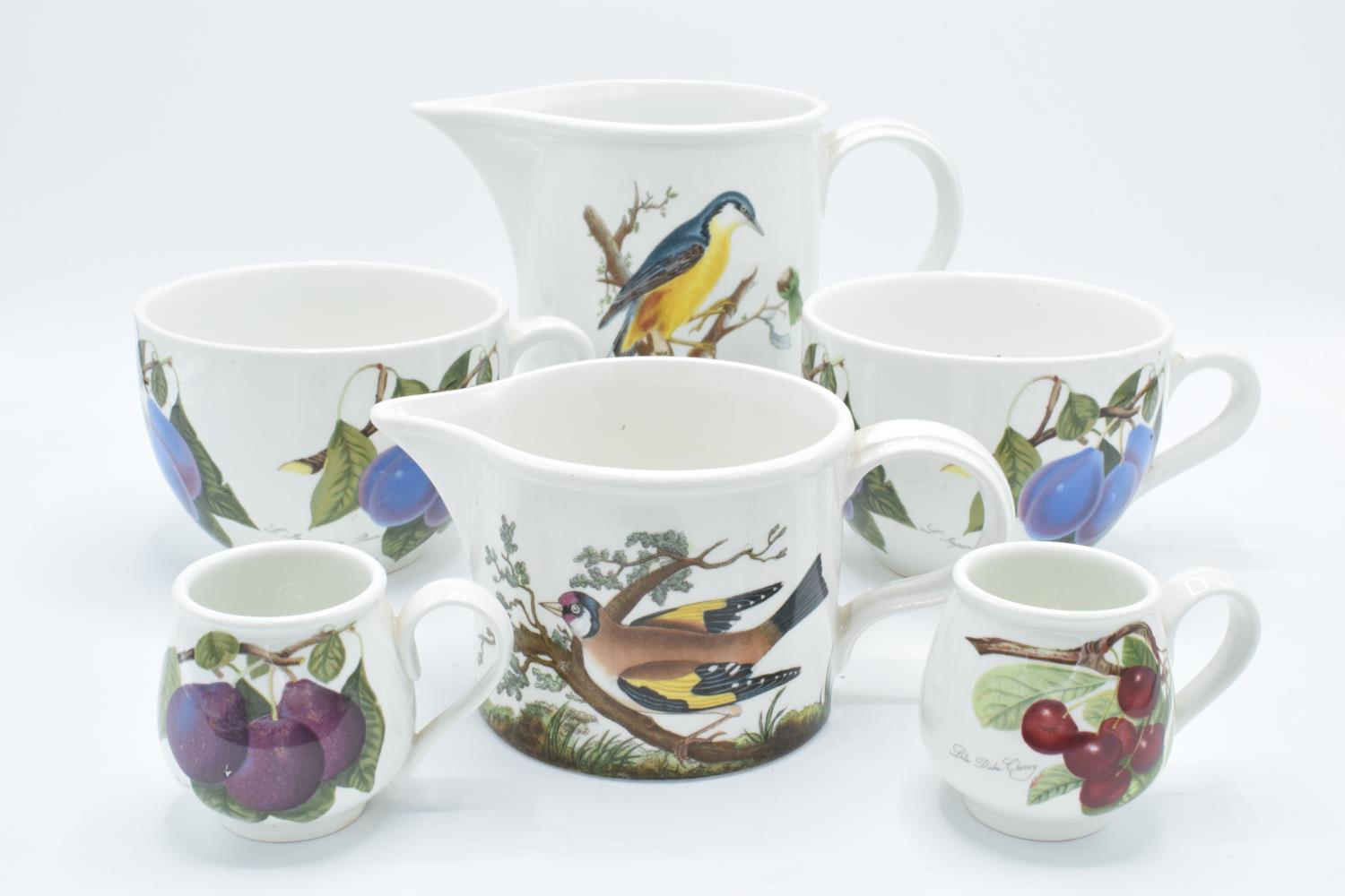 A collection of Portmeirion items to include large breakfast mugs, plates, a platter and various