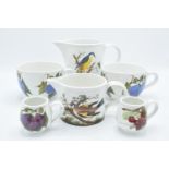 A collection of Portmeirion items to include large breakfast mugs, plates, a platter and various