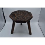 Arts & crafts carved oak Stool. 31cm tall. In good condition.