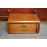 A late 19th/ early 20th century oak cased cutlery canteen with brass fixtures by Robert F Mosley