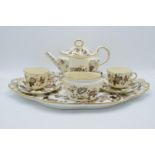 An English 19th century tea for two set to consist of a teapot, 2 duos, milk and sugar and a large
