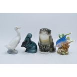 A collection of pottery to include a USSR Cat 2003, Poole pottery Otter, Nao duck and a Royal