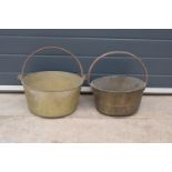 A pair of antique brass jam pans in good condition, largest 36cm diameter.