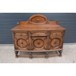 An Edwardian carved sideboard with 3 drawers over 3 cupboards. 153 x 55 x 131cm. One drawer is in