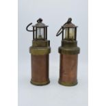 A pair of brass and copper miner's lamps 28cm tall. In good condition and display well. Sold as