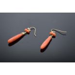 A pair of gold and coral ladies drop-pendant earrings (2). Tests as 9ct or better.