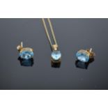 10ct gold pendant and ear stud combo set with blue topaz stones. Total weight 1.6 grams.