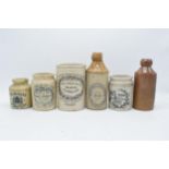 A collection of vintage stoneware advertising jars and bottles to include Burgess Finest Caviar, H F