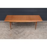 A mid century / retro Gordon Russell teak coffee table on tapered legs. 122 x 47 x 40cm. In good