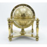 A 20th century cast brass spinning globe with star signs and dates of the month on the support