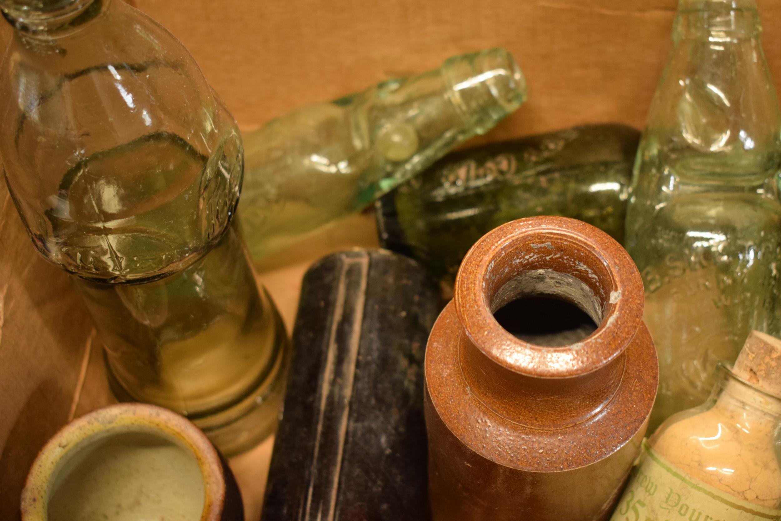 A mixed collection of vintage items to include stoneware jars and advertising glass bottles to - Image 2 of 5