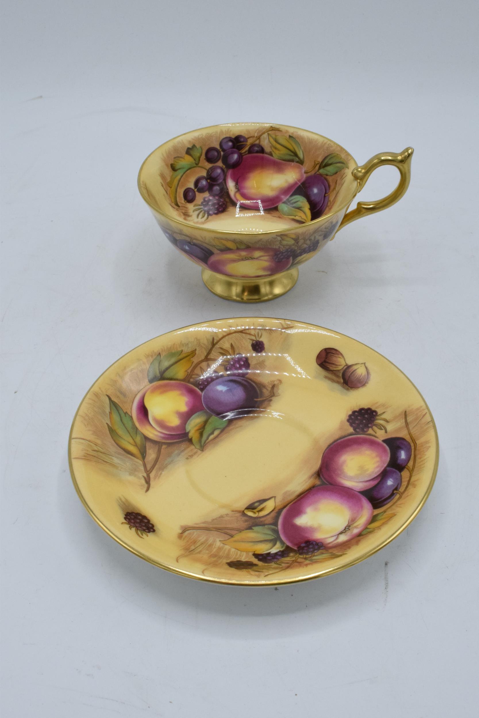 Aynsley cup and saucer in the Orchard Gold design (2). Both pieces are signed by N. Brunt. In good - Image 2 of 8