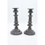 A pair of 19th century pewter candlesticks. 22cm tall. In good condition with some wear and tear.