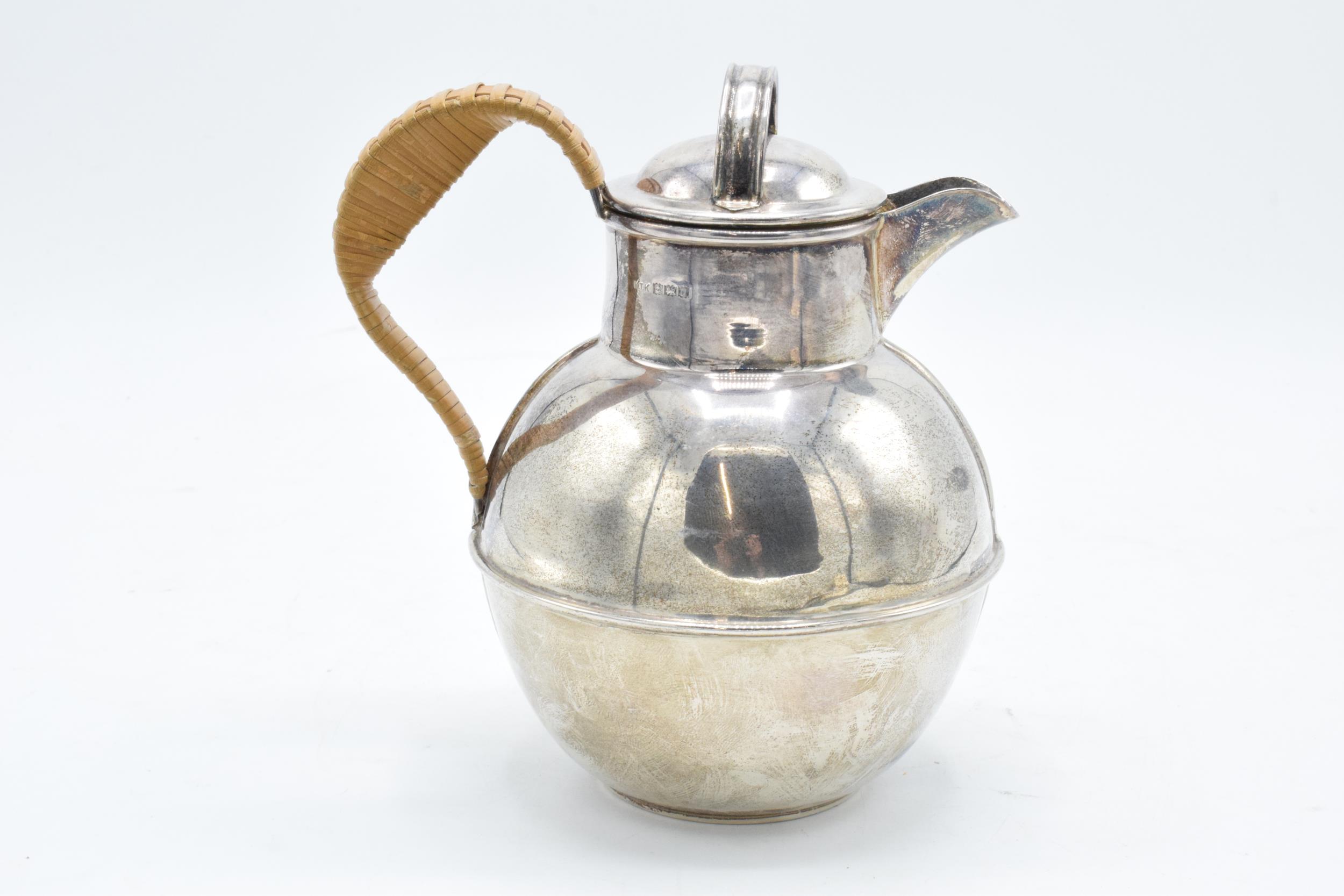 A hallmarked silver Jersey style cream jug with wicker style handle. Gross weight 315.6 grams. - Image 2 of 6