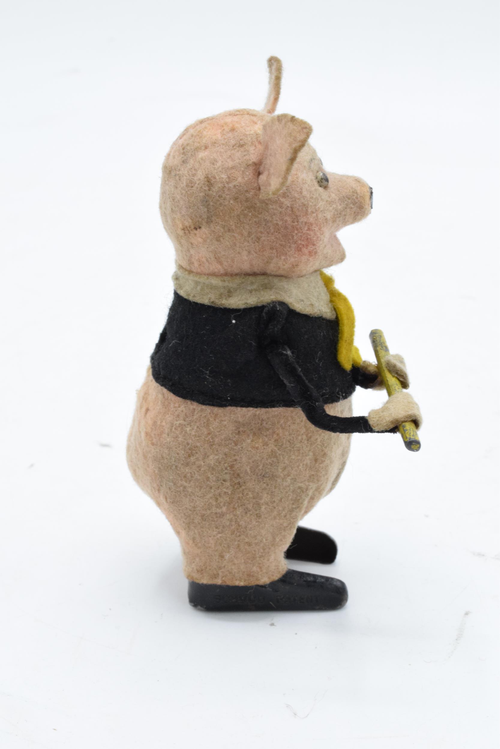 A Schuco circa 1930s clockwork toy figure in the form of a pig with a flute (with key). Based on the - Image 5 of 7