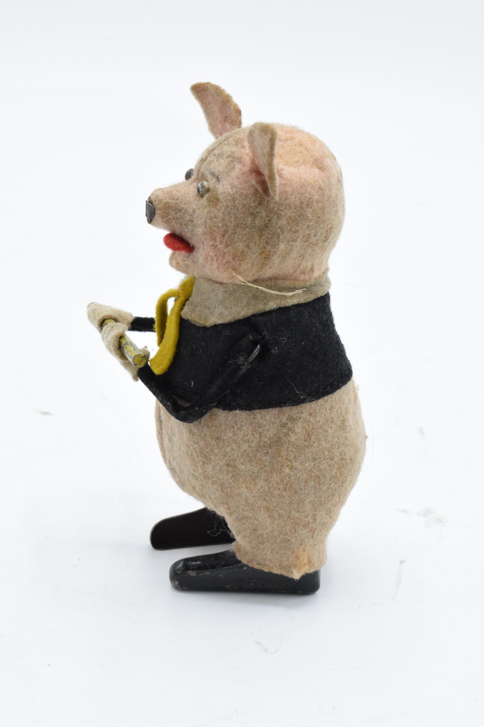 A Schuco circa 1930s clockwork toy figure in the form of a pig with a flute (with key). Based on the - Image 3 of 7