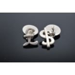 A pair of silver (925) cufflinks in the form of a dollar and a pound sign. 8.7 grams.