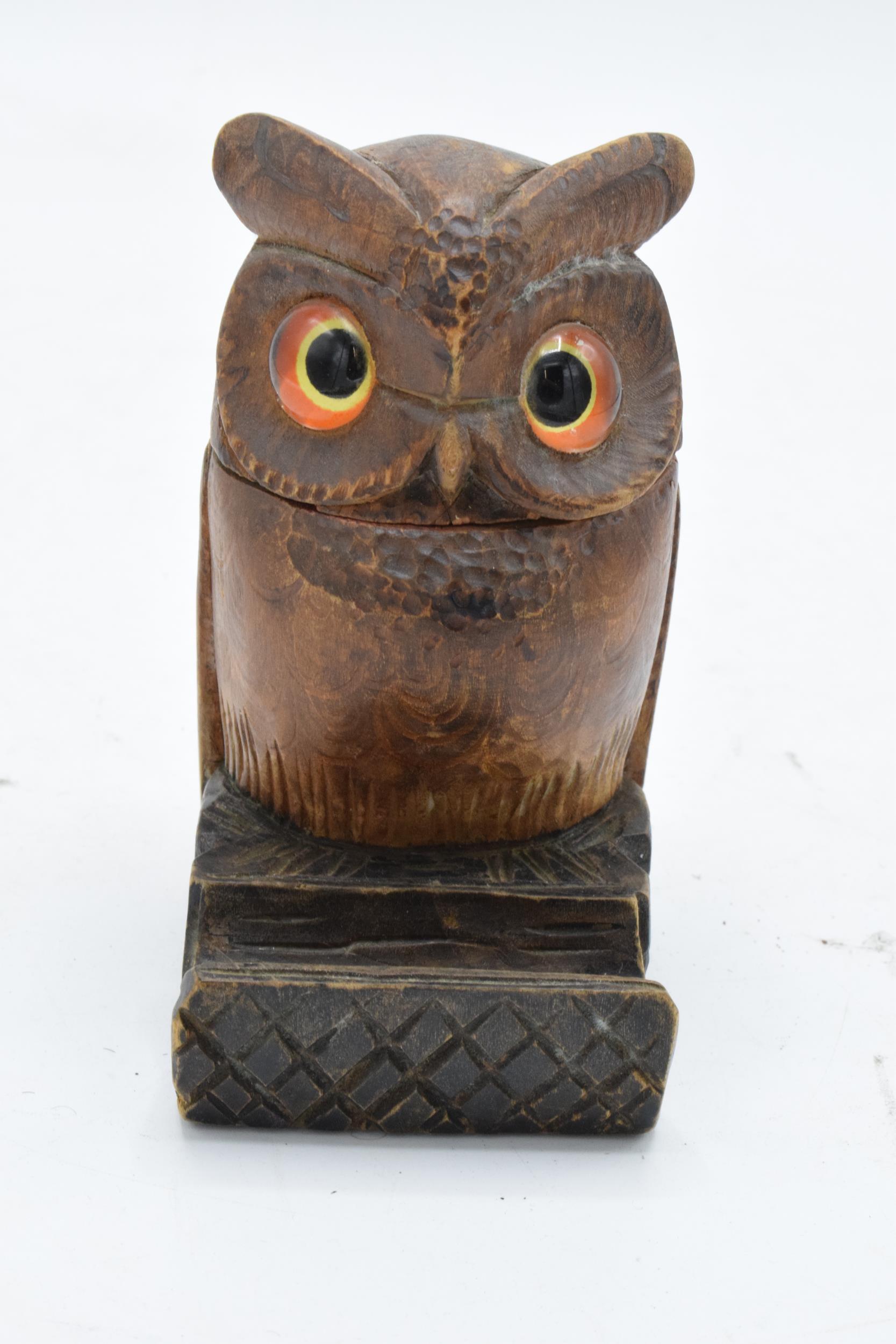 A treen owl inkwell with glass eyes in the Black Forest style. 10cm tall. (1226).