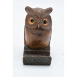 A treen owl inkwell with glass eyes in the Black Forest style. 10cm tall. (1226).