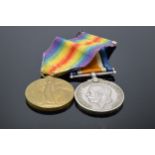 A pair of World War One (WW1) medals awarded to '123755 GNR J. Smith R.A.' to include George V