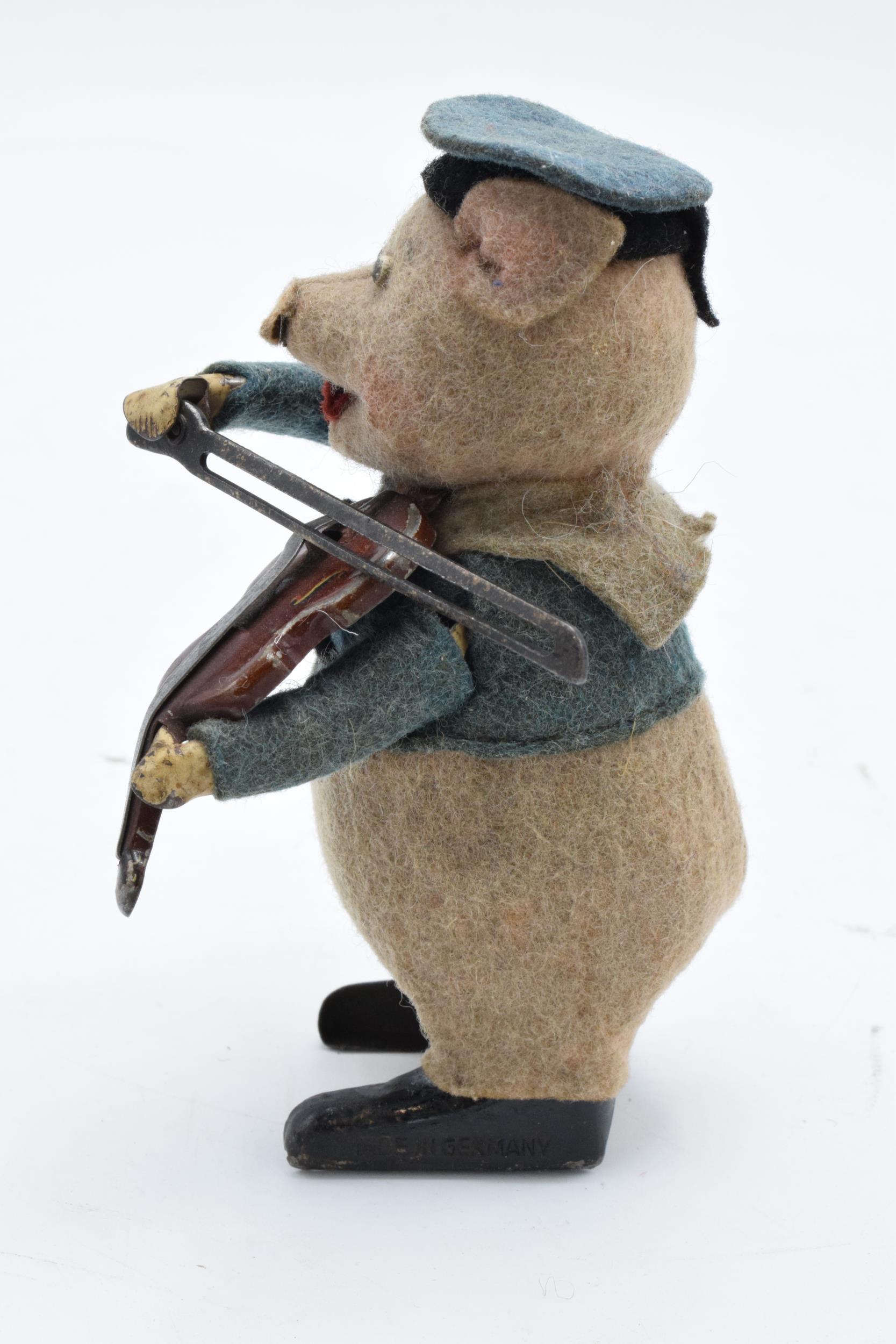 A Schuco circa 1930s clockwork toy figure in the form of a pig with a violin. Based on the Three - Image 3 of 9