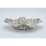 An ornate silver basket hallmarked for London 1904. 210.5 grams. 25cm wide. With inscription. In