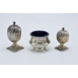 A collection of hallmarked silver items to include acorn shaped cruet shakers (42.3 grams of silver)