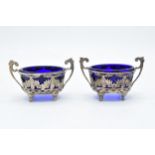 A pair of silver table salts with associated blue glass liners (2). Chester 1894. 101.3 grams of