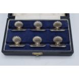 A cased set of 6 Portuguese silver menu holders in the form of shells. 42.5 grams. A stunning set.