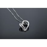 9ct white gold and diamond heart pendant on a 9ct white gold chain. 1.7 grams.