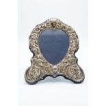 A hallmarked silver fronted picture frame with a cherub design. Hallmarked for Birmingham 1996-