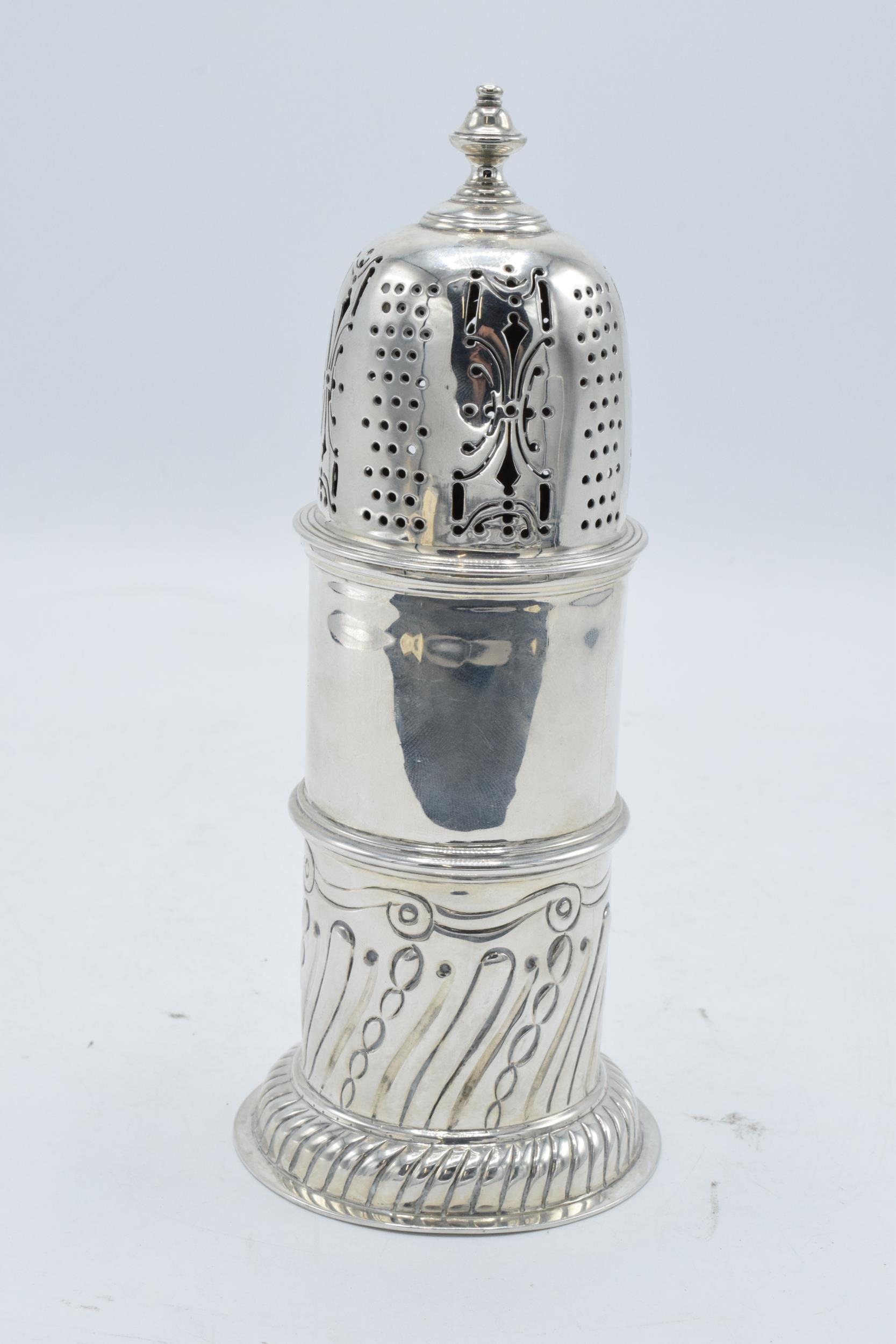 Large ornate silver sugar sifter / caster. 258.5 grams. Hallmarks on body rubbed. 19.5cm tall. In