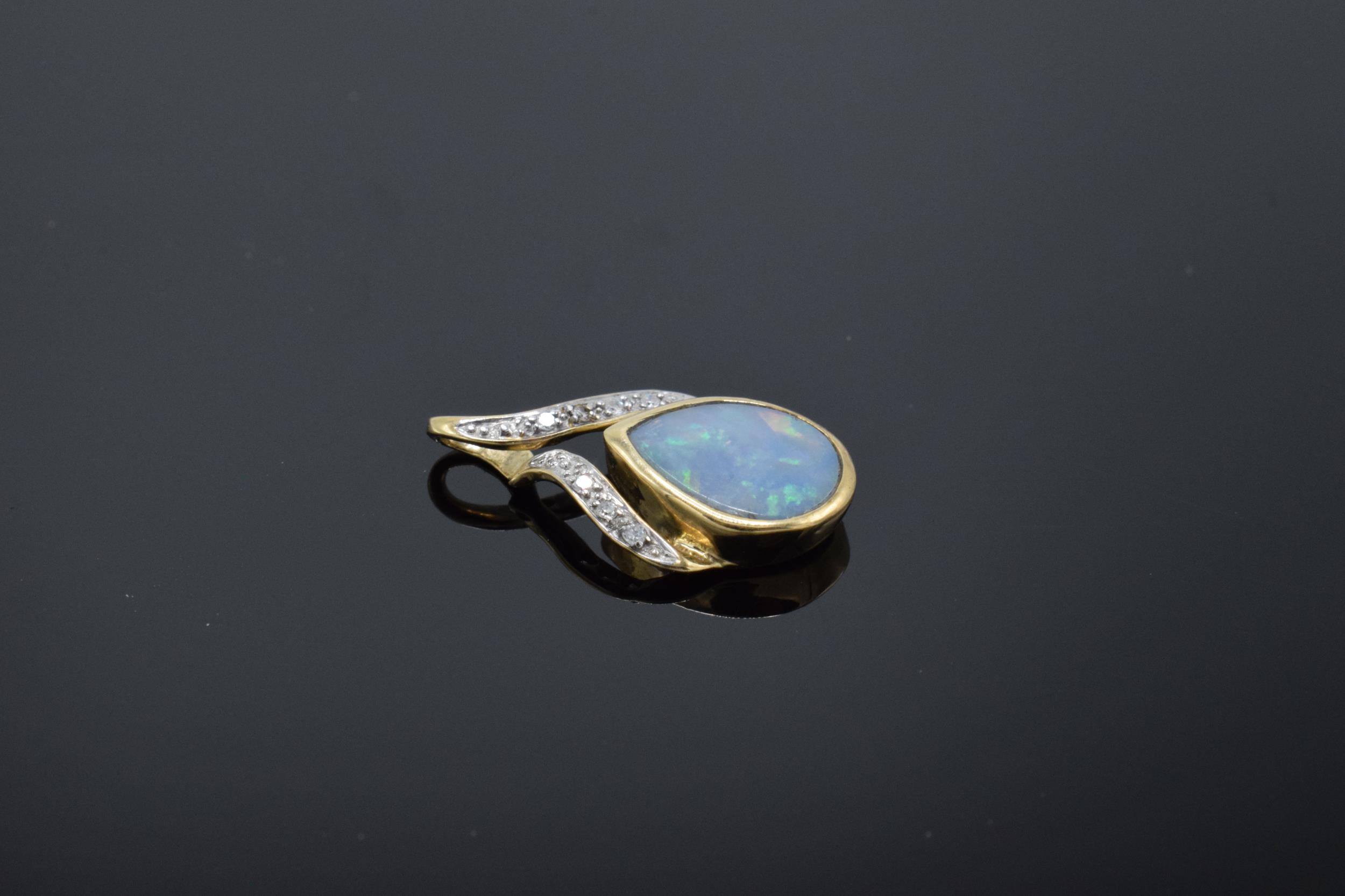 A 9ct gold pendant set with opal stone and illusion set diamonds. 1.0 grams. - Image 2 of 4