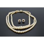 Three row cultured pearl necklace with 9ct gold clasp, together with similar cultured pearl and