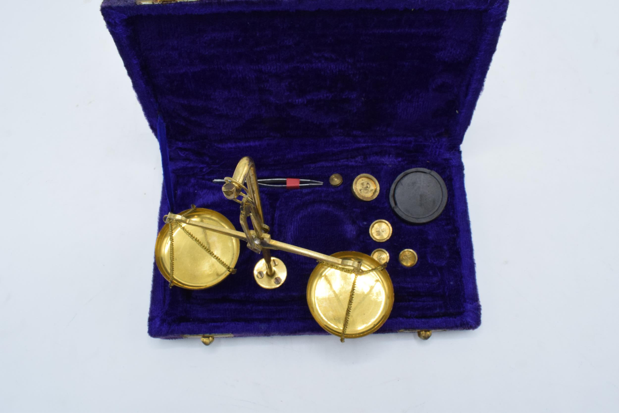 A cased set of brass portable scales with weights as large as 10 grams. - Image 3 of 4