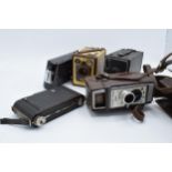 A collection of vintage cameras in carry cases to include a Brownie Six-20 Model F, Kodak Brownie