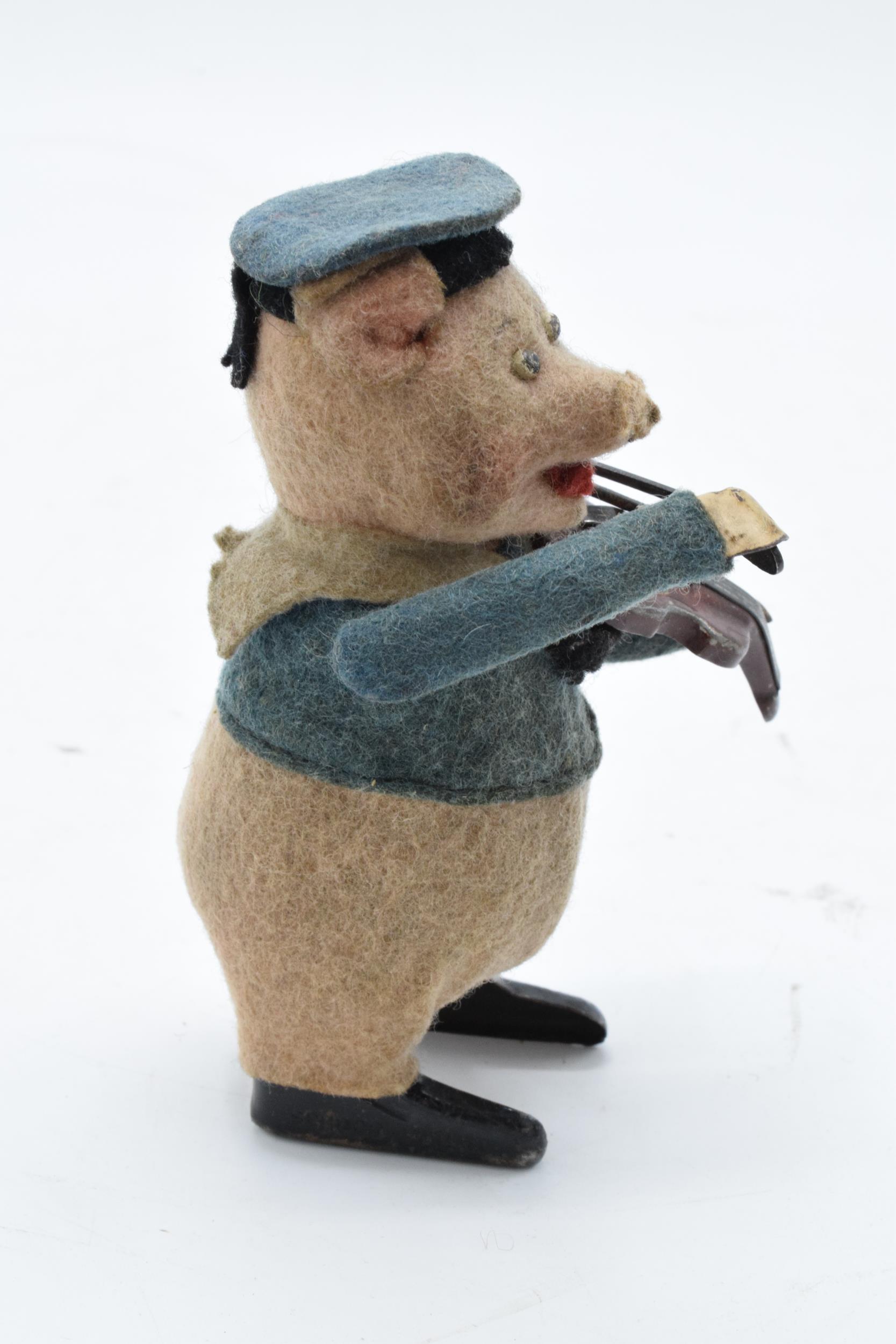 A Schuco circa 1930s clockwork toy figure in the form of a pig with a violin. Based on the Three - Image 5 of 9