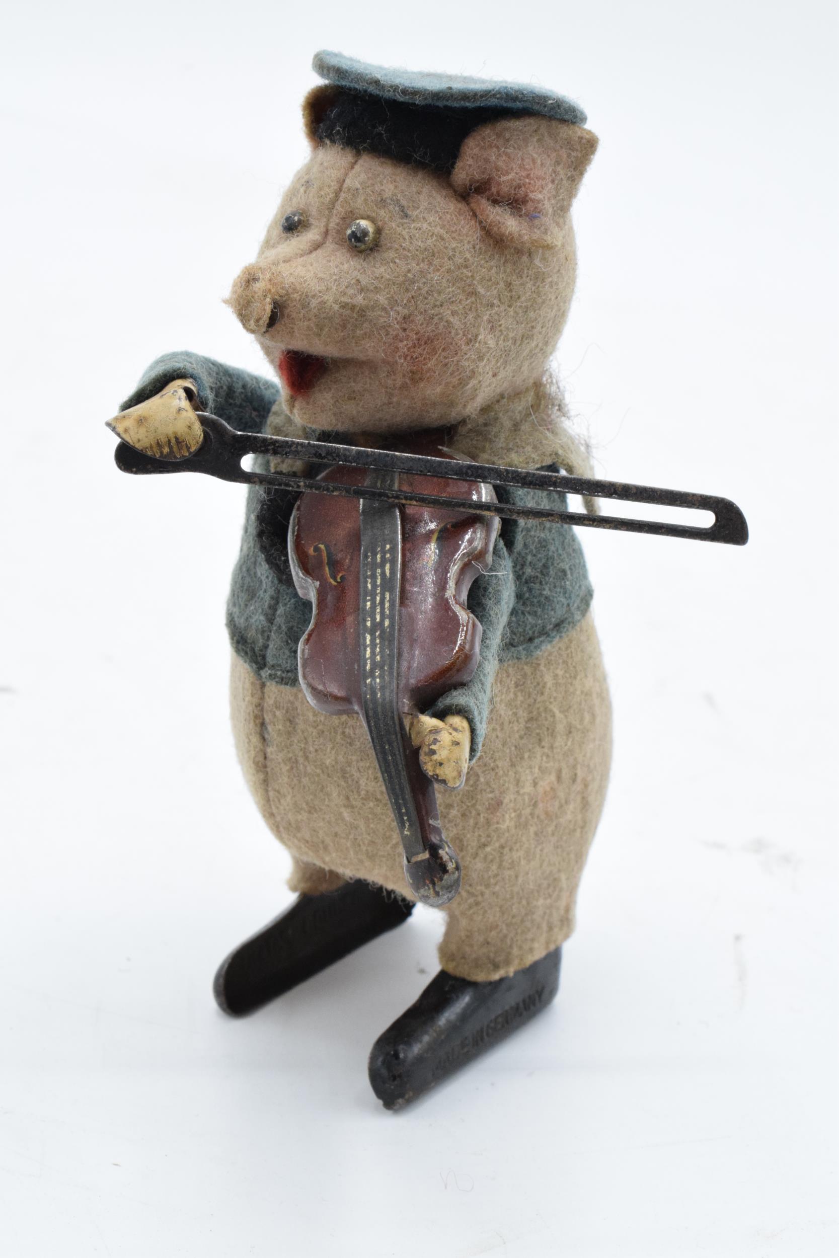 A Schuco circa 1930s clockwork toy figure in the form of a pig with a violin. Based on the Three - Image 2 of 9