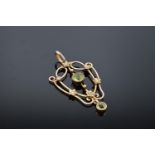 An antique 9ct gold ornate pendant set with peridot and pearls. Gross weight 2.1 grams. Stamp to