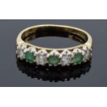 9ct gold ladies ring set with emerald and CZ stones. Size O. Total weight 2.5 grams.