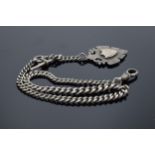 A hallmarked silver Albert watch chain with bar and shield fob. 35cm long. 24.7 grams.