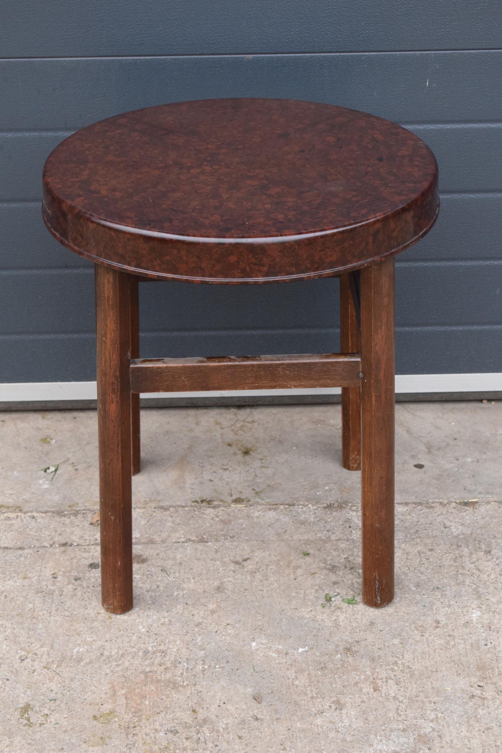 An Art Deco bakelite and beech occasional table. Circa 1930 and stamped on the underside ?GB Ltd HW?