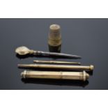 French early 20th century silver gilt sewing kit to consist of a thimble and a needle amongst