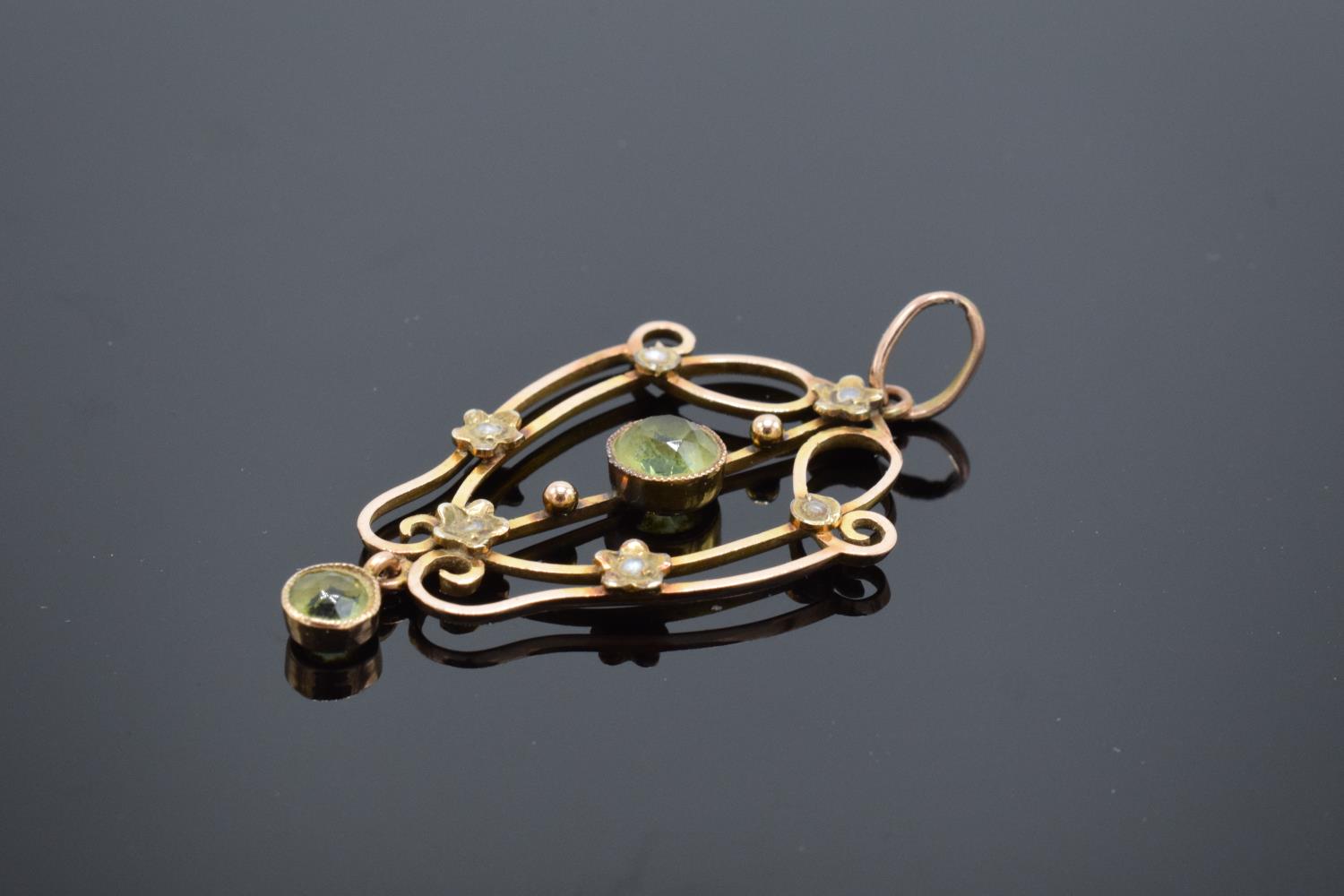 An antique 9ct gold ornate pendant set with peridot and pearls. Gross weight 2.1 grams. Stamp to - Image 2 of 4