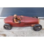 A vintage Reprocrafters style large model of a vintage car. 75cm long. In good condition generally